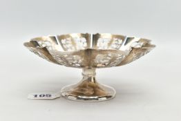 AN EARLY 20TH CENTURY SILVER TAZZA, open work scrolling design, scalloped edge, short stem leading