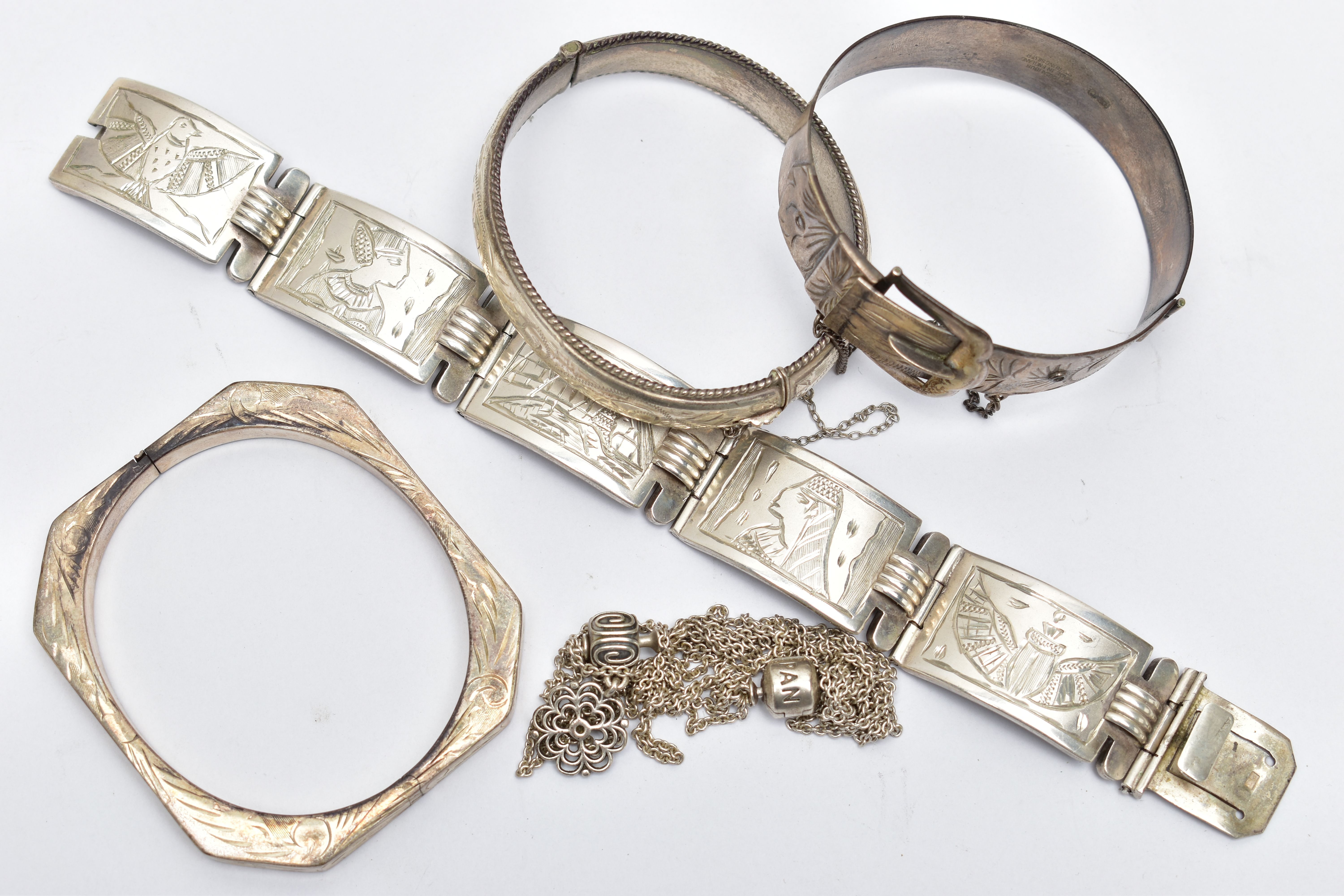 AN ASSORTMENT OF SILVER AND WHITE METAL JEWELLERY, to include a silver buckle bangle, hallmarked