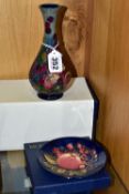 A BOXED MOORCROFT POTTERY FINCHES VASE AND PIN DISH, the bud vase tube lined with Finches pattern on