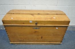 A LATE 19TH EARLY 20TH CENTURY PINE DOME TOP TRUNK, with twin iron handles, length 92cm x depth 50cm