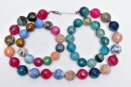 A BEADED NECKLAE AND TWO BRACELETS, a necklace comprised of twenty two faceted beads, assessed as