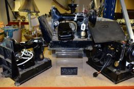 THREE EARLY TWENTIETH CENTURY SINGER SEWING MACHINES, model 221K and similar models with fold out