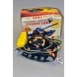 A BOXED MARX TOYS STEERING TANK, remote controlled, battery operated, in playworn condition, with