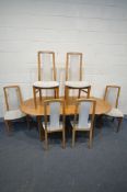 AN 1980'S OAK EXTENDING DINING TABLE, with a single fold out leaf, open length x depth x height, and