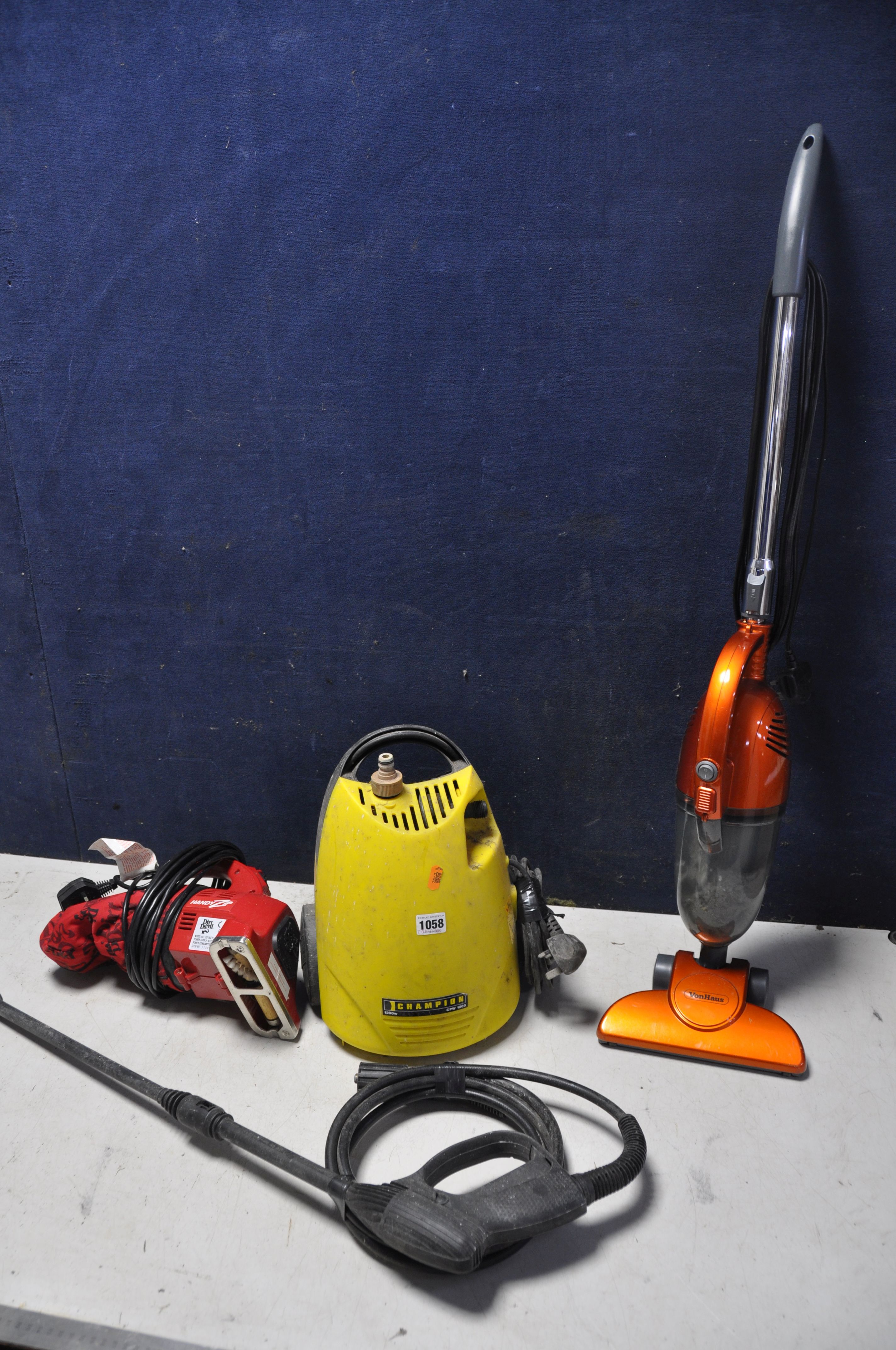 A CHAMPION CPW1200 PRESSURE WASHER with hose and lance, along with a VonHaus 07/200 vacuum and a