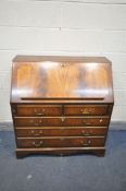 A LATE 20TH CENTURY MAHOGANY BUREAU, with a fitted interior, over two short and three long