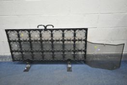 A WROUGHT IRON ECCLESIASTICAL FIRESCREEN, with a mesh backing, width 127cm x height 66cm and another