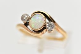 A YELLOW METAL OPAL AND DIAMOND DRESS RING, the central opal cabochon, collet set, with old cut