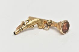 TWO YELLOW METAL NOVELTY WATCH KEYS, the first designed as a pistol gun, unmarked yellow metal,