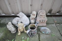 A SELECTION OF COMPOSITE GARDEN FIGURES, to include a hedgehog in an armchair, an owl, squirrel, etc