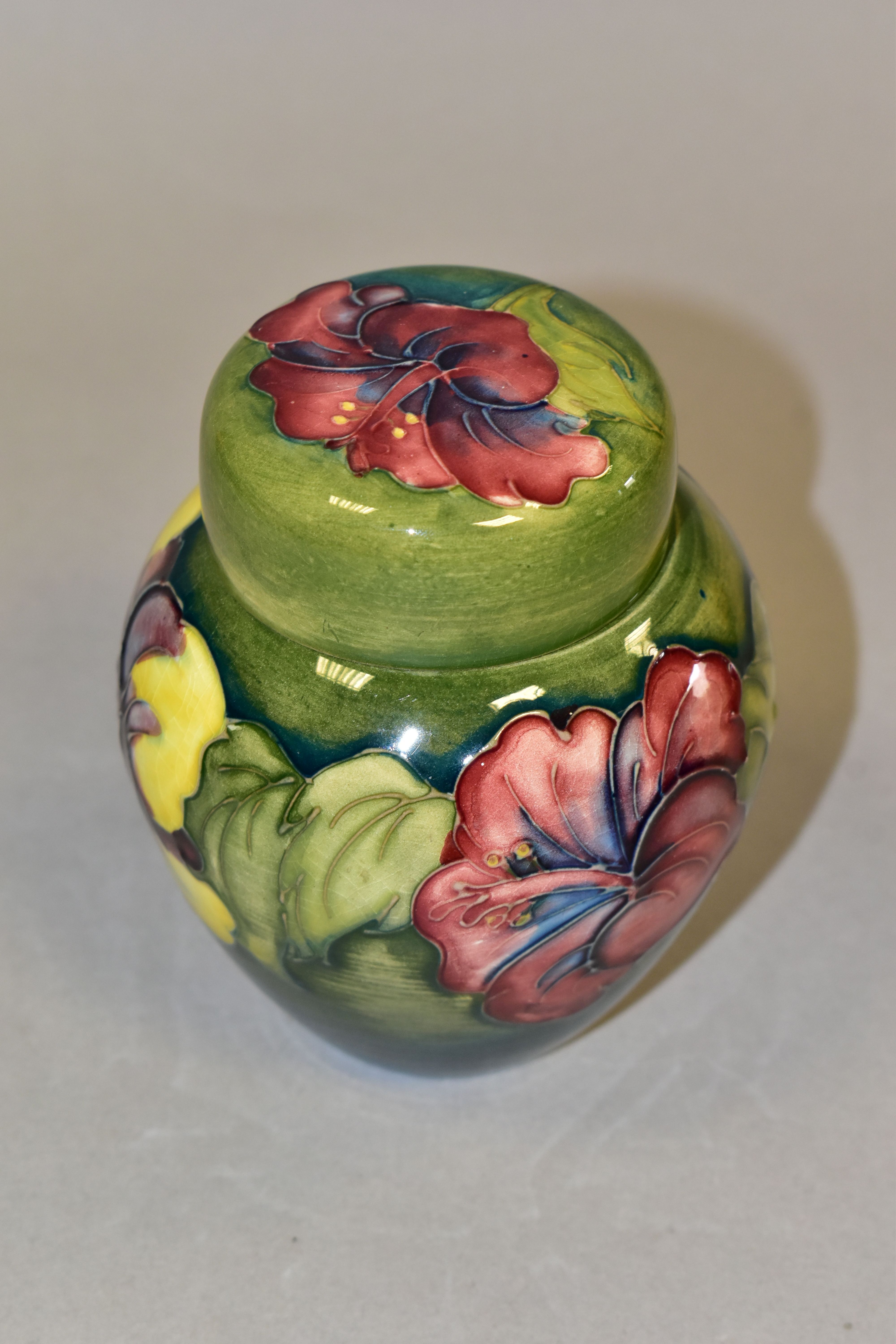 A MOORCROFT POTTERY HIBISCUS PATTERN COVERED GINGER JAR, the green ground decorated with pink, - Image 2 of 4