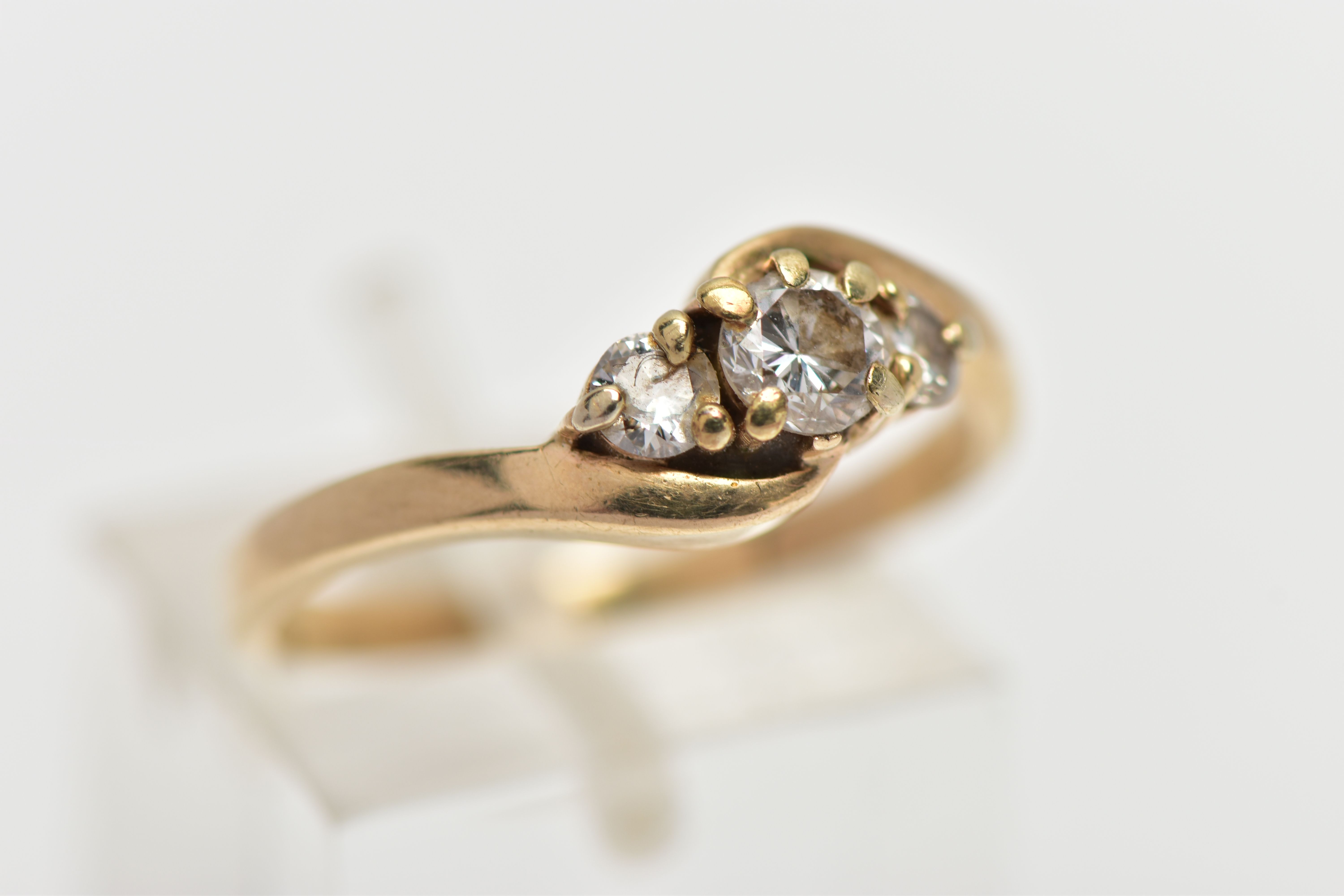 A 9CT GOLD DIAMOND THREE STONE RING, comprising three graduated brilliant cut diamonds, to the - Image 4 of 4