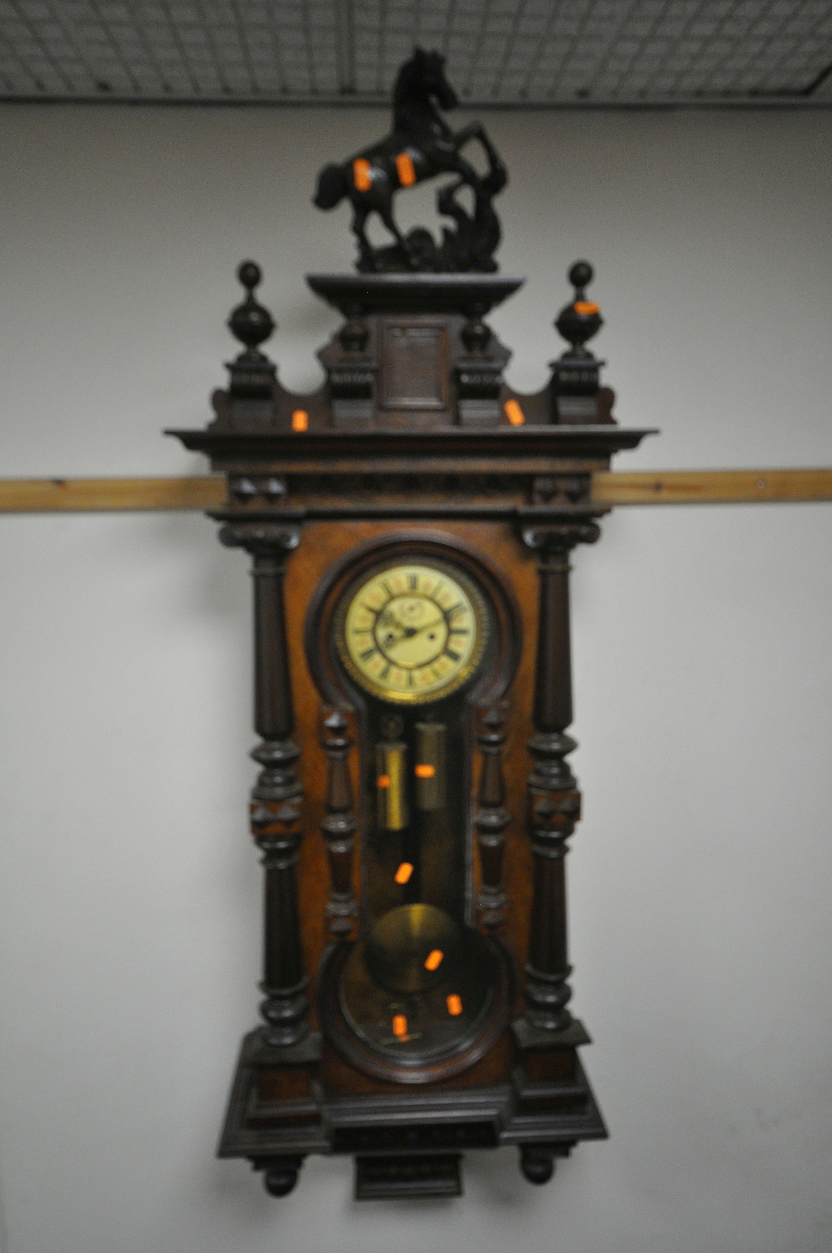 A LATE 19TH CENTURY REGULATOR VIENNA WALL CLOCK, having a resin horse finial, the door with