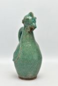 A PRE- COLUMBIAN STYLE GREEN GLAZED POTTERY FLASK IN THE FORM OF A CHICKEN, with a small hole in the