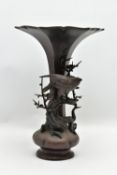 A LATE 19TH CENTURY JAPANESE MEIJI PERIOD BRONZE VASE, the trumpet shaped rim over a slender