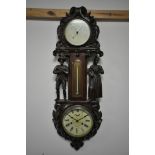 A FIGURAL ANEROID BAROMETER/CLOCK, depicting standing Amish male and female figures, and a clock