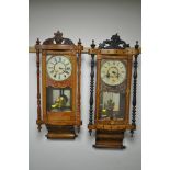 TWO LATE 19TH CENTURY AMERICAN WALNUT AND INALID WALL CLOCKS, with a foliate decorated finial,