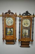 TWO LATE 19TH CENTURY AMERICAN WALNUT AND INALID WALL CLOCKS, with a foliate decorated finial,