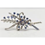 A MID 20TH CENTURY WHITE METAL DIAMOND AND SAPPHIRE FLORAL SPRAY BROOCH, set with a principal square