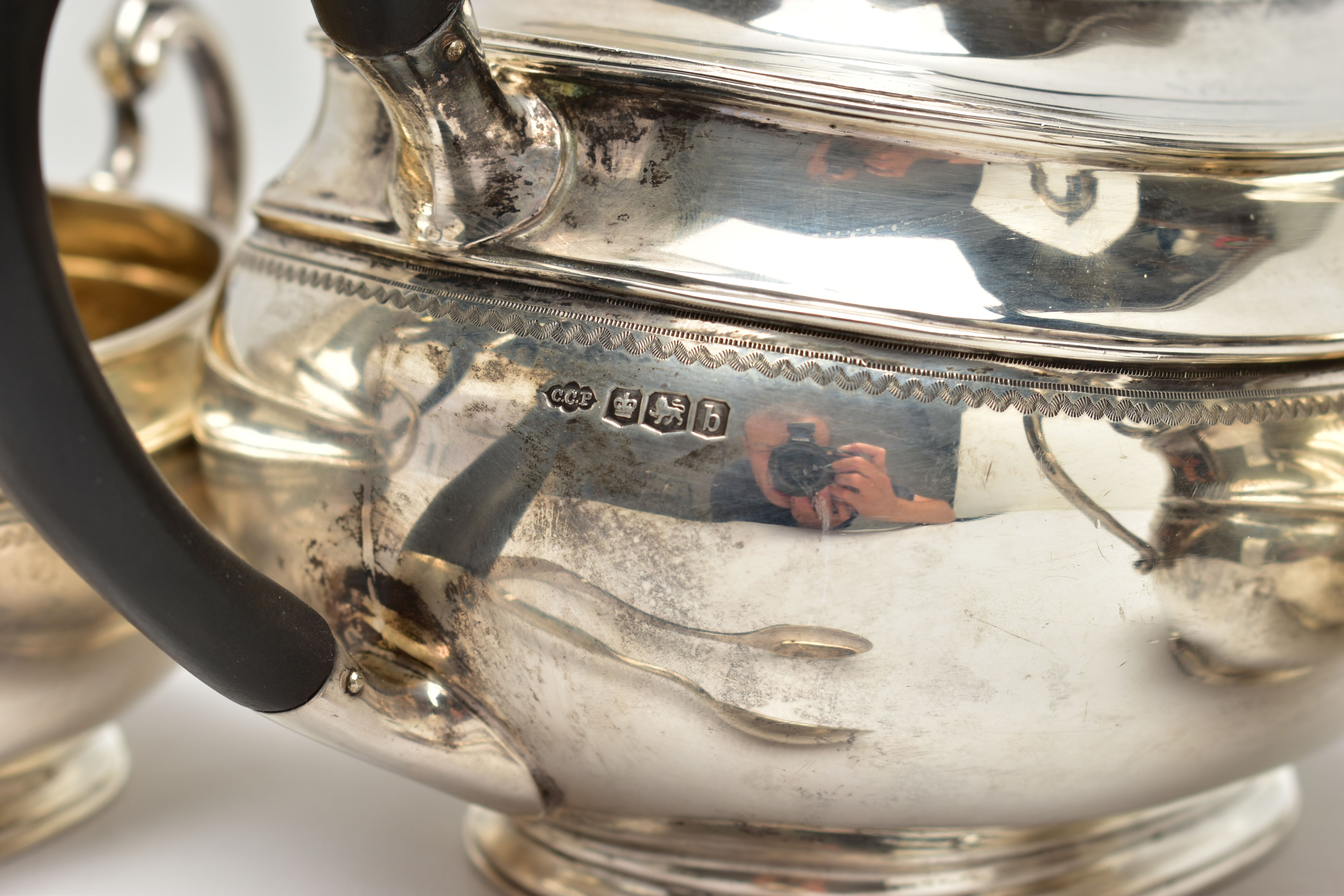 A GEORGE V SILVER FOUR PIECE TEA SERVICE OF OVAL FORM, comprising tea pot, hot water/coffee jug, - Image 7 of 9