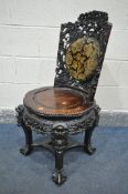 AN INTRICATLY CARVED CHINESE HARDWOODCHAIR, late 19th/early 20th century, flower heads and vines