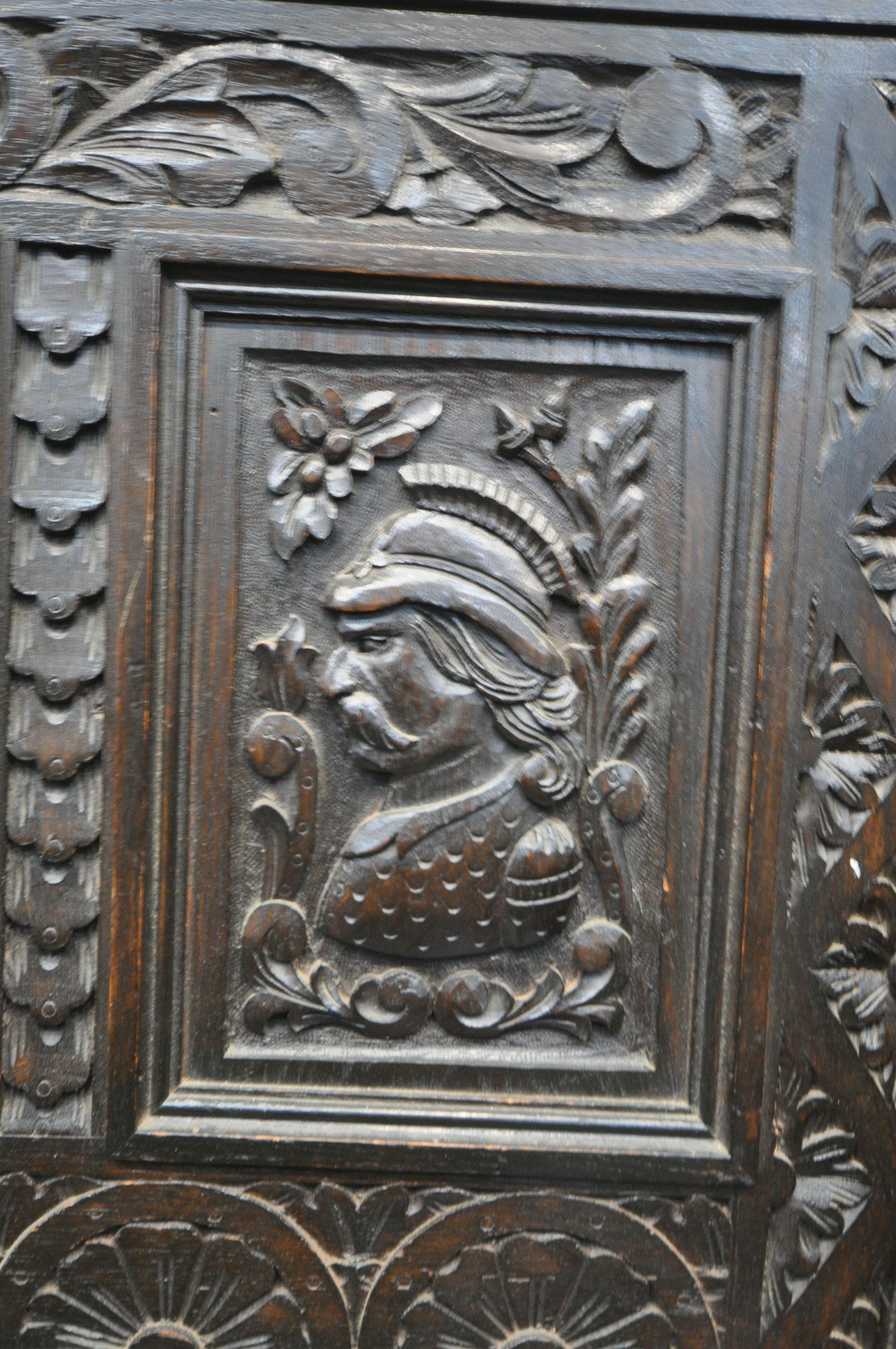 A LATE 19TH CENTURY CARVED OAK JACOBETHAN STYLE HALL SETTLE/BENCH, the two outer panels depicting - Image 6 of 9