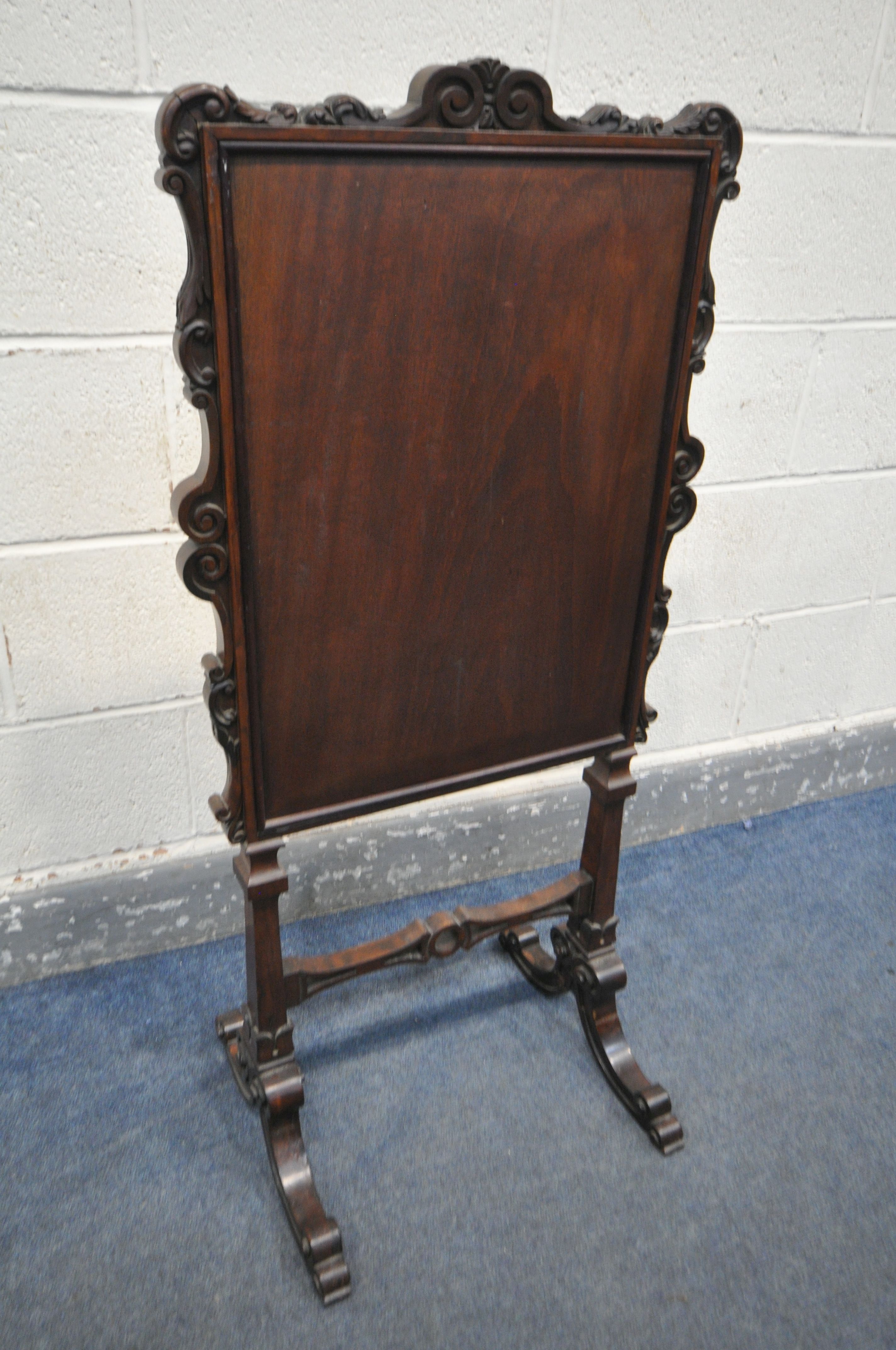 AN EARLY VICTORIAN ROSEWOOD FIRESCREEN, the frame with foliate scrolls, the glass panel enclosing - Image 5 of 5