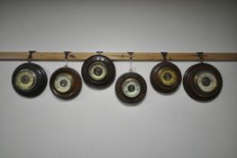 SIX LATE 19TH/EARLY 20TH CENTURY CARVED WOOD CIRCULAR BAROMETERS, all unsigned, largest diameter