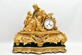 A MID 19TH CENTURY GILT METAL MANTEL CLOCK, cast with a seated figure of Christ and two children,