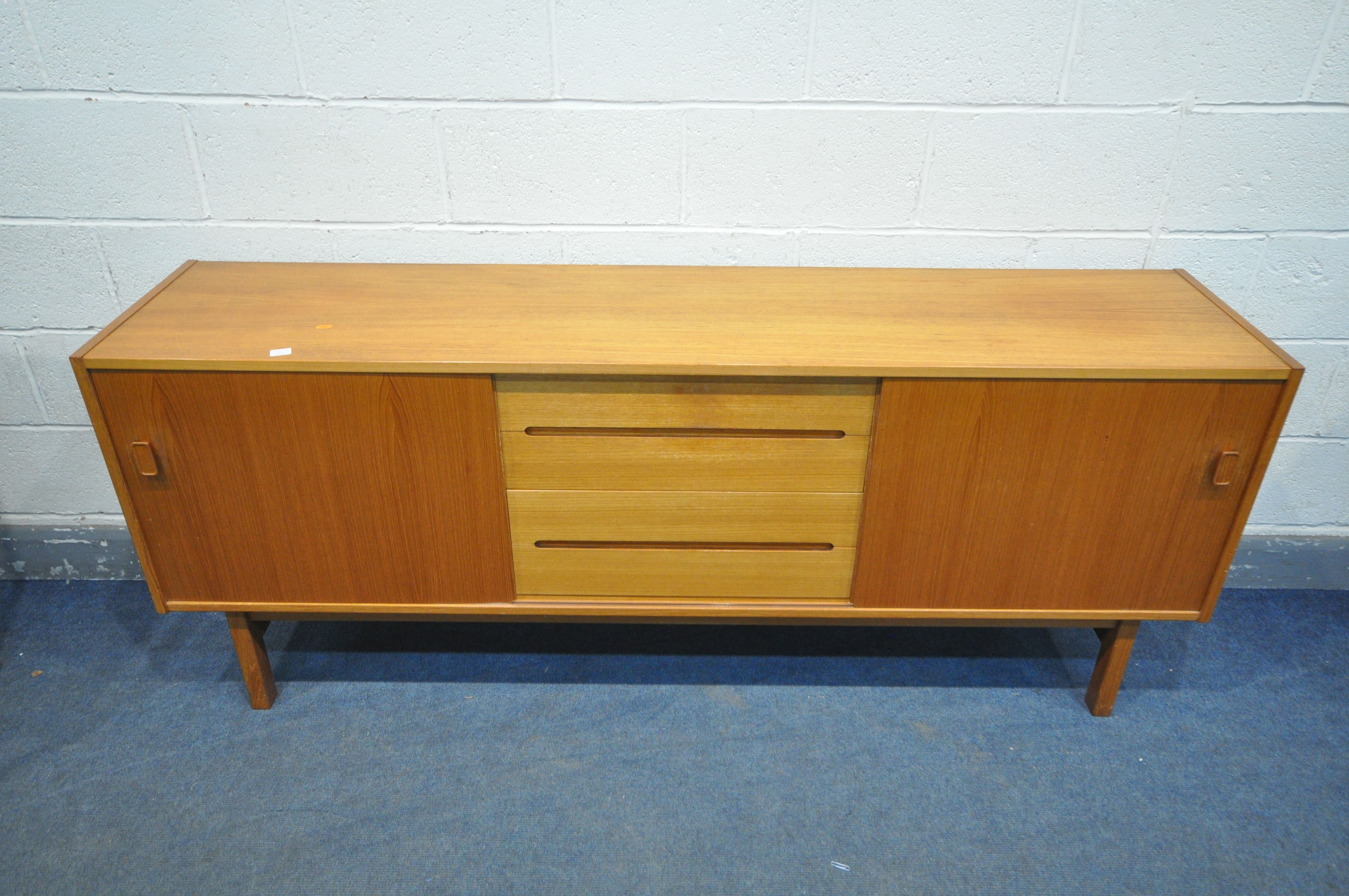 NILS JONSSON FOR HUGO TROEDS, A MID CENTURY MODEL TEAK SIDEBOARD, with two sliding doors that are - Image 2 of 7