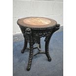 AN INTRICATLY CARVED CIRCULAR CHINESE ROSEWOOD SIDE TABLE, with a veined marble insert, the four