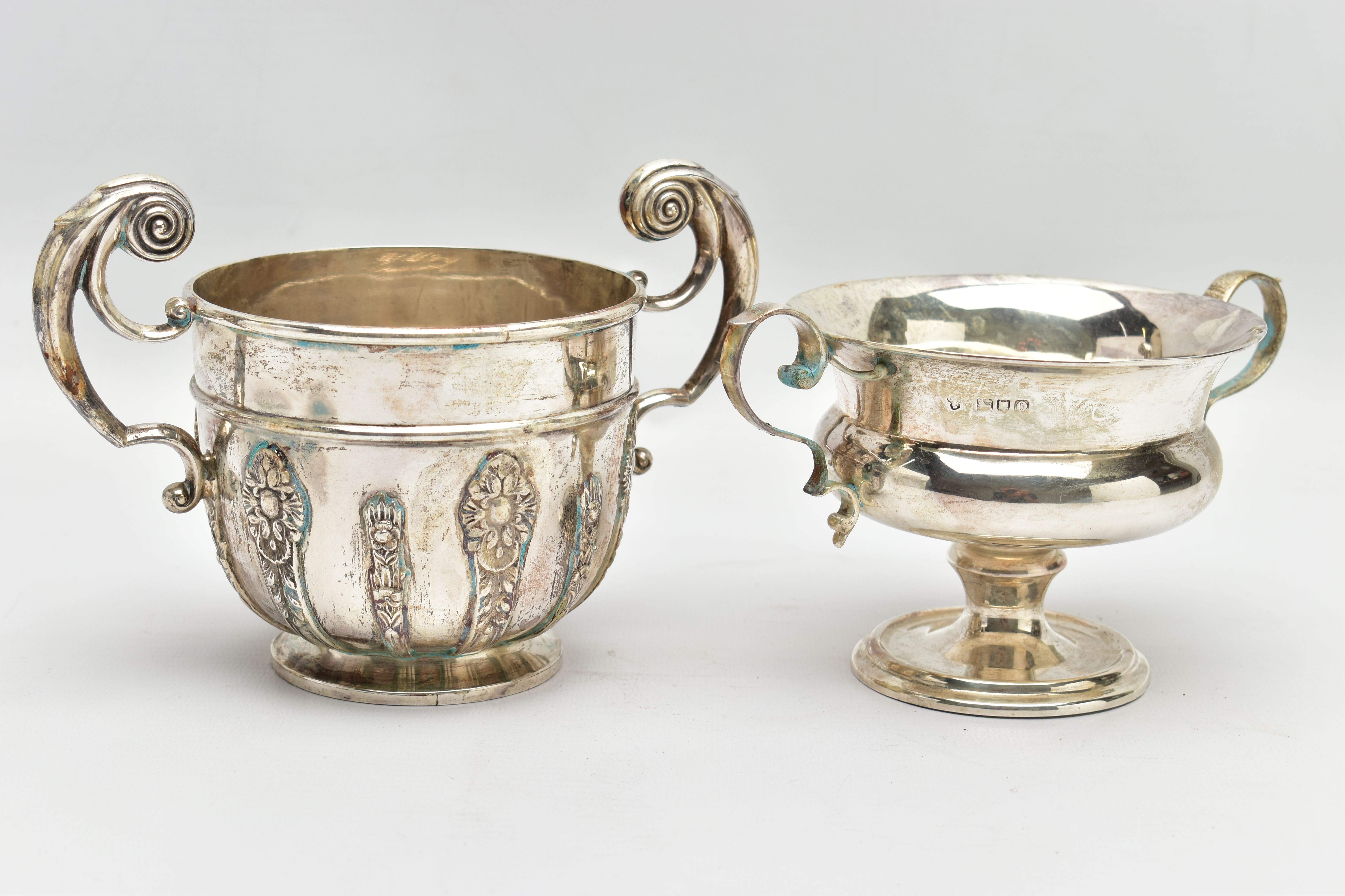 A GEORGE V WALKER & HALL SILVER TWIN HANDLED LOVING CUP AND AN EDWARDIAN TWIN HANDLED PEDESTAL