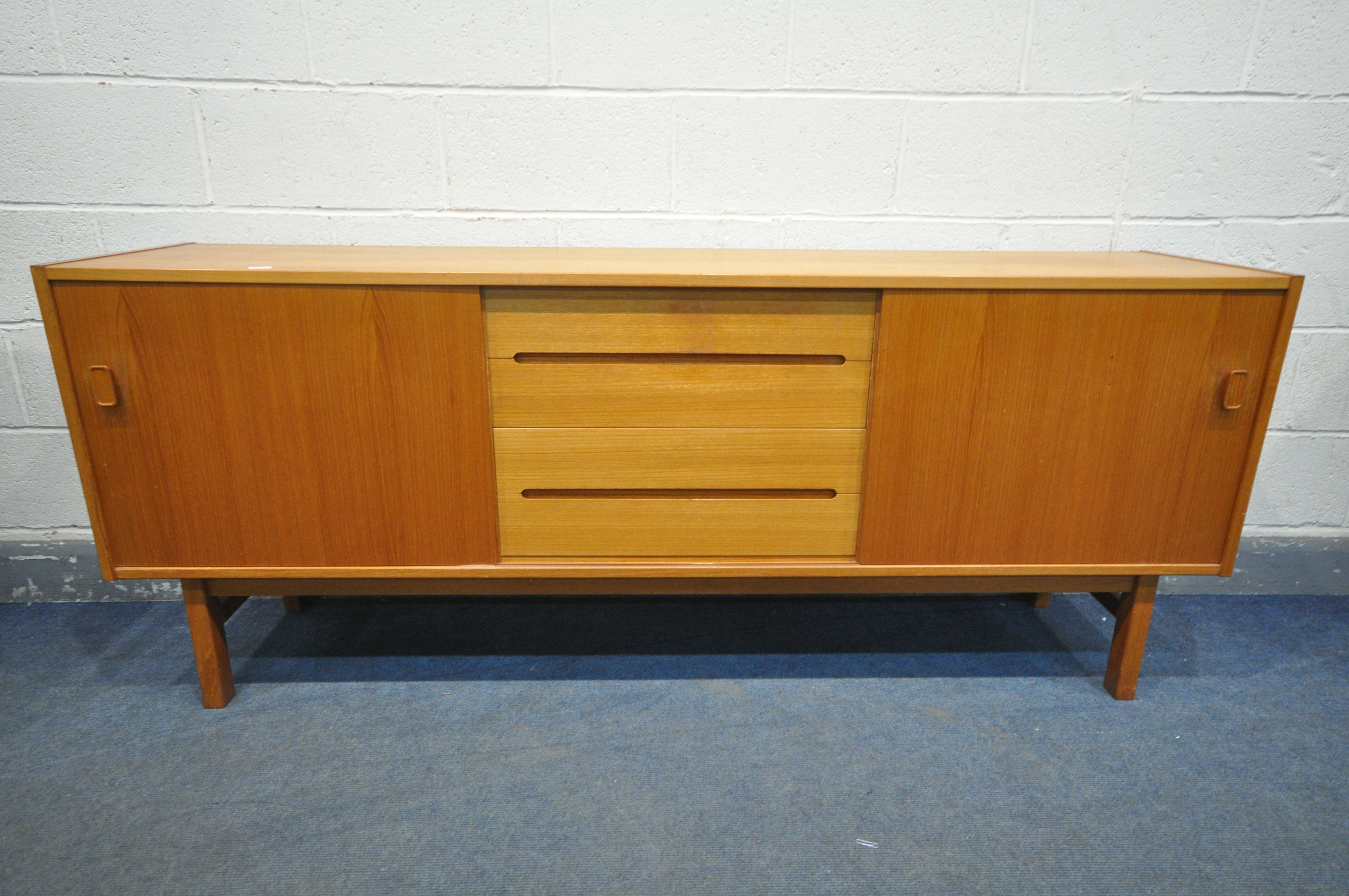 NILS JONSSON FOR HUGO TROEDS, A MID CENTURY MODEL TEAK SIDEBOARD, with two sliding doors that are