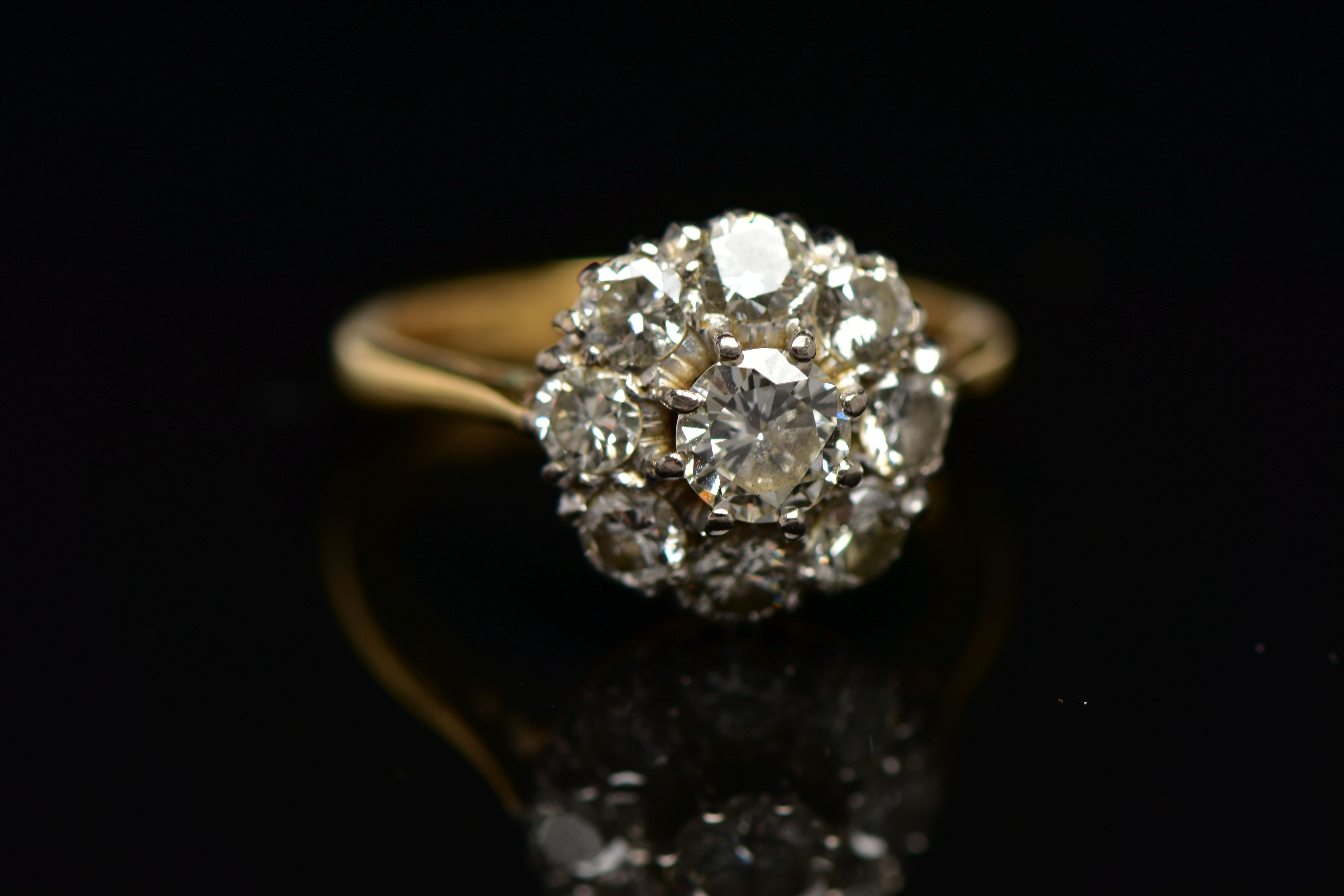 A DIAMOND NINE STONE CLUSTER RING, set with a principal round brilliant cut diamond, surrounded by - Image 8 of 9