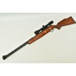 A .22” WEIHRAUCH HW77 SPRING OPERATED AIR RIFLE, serial number 1011086, it is in good working