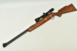 A .22” WEIHRAUCH HW77 SPRING OPERATED AIR RIFLE, serial number 1011086, it is in good working