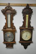 TWO EARLY 20TH CENTURY OAK/MAHOGANY ANEROID BAROMETERS, both with thermometers with one that has a