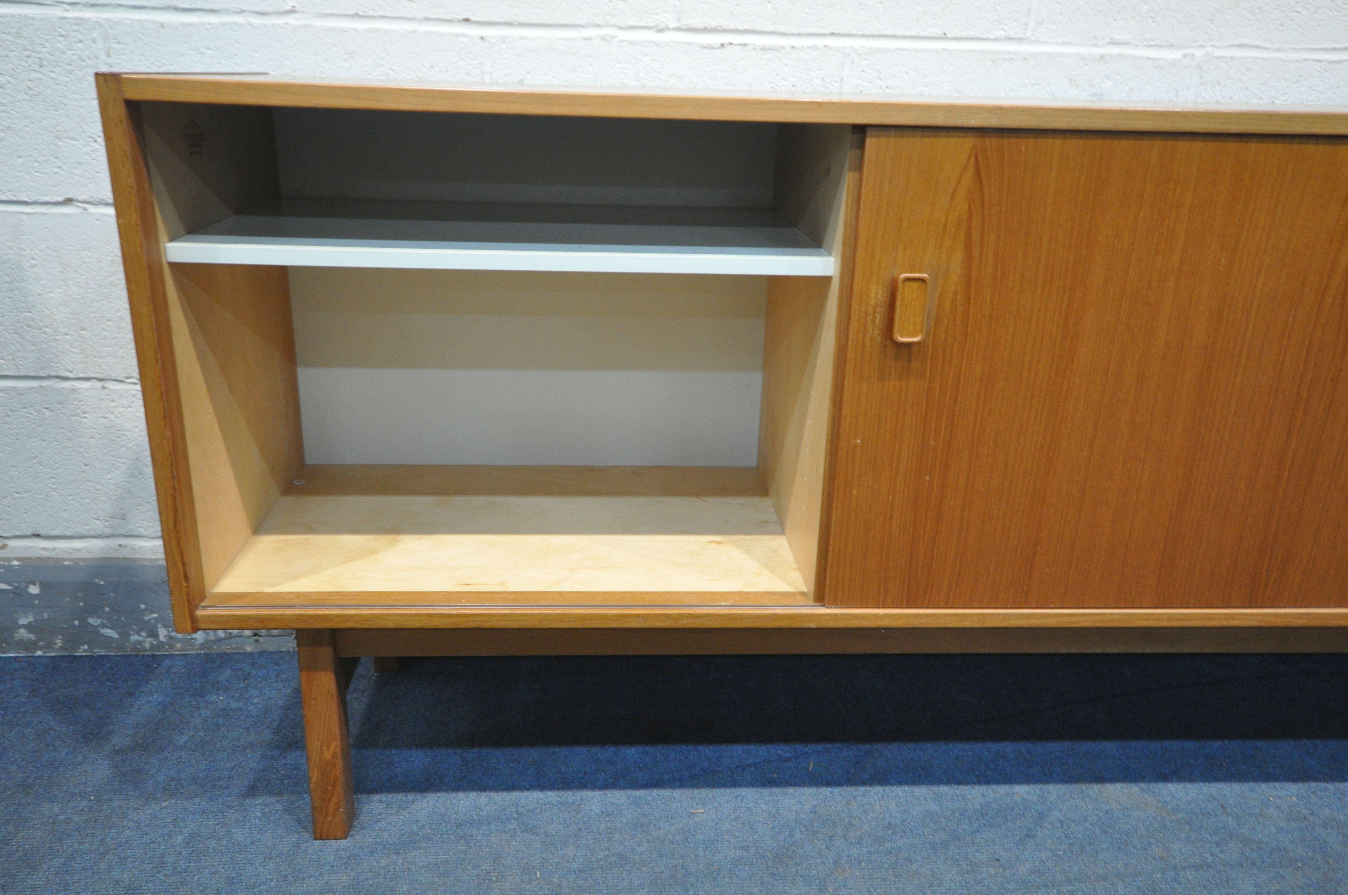 NILS JONSSON FOR HUGO TROEDS, A MID CENTURY MODEL TEAK SIDEBOARD, with two sliding doors that are - Image 5 of 7