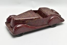 A CODEG MOTTLED BROWN BAKELITE MODEL OF AN OPEN TOP TOURER CAR, moulded as a single piece, 'CODEG'