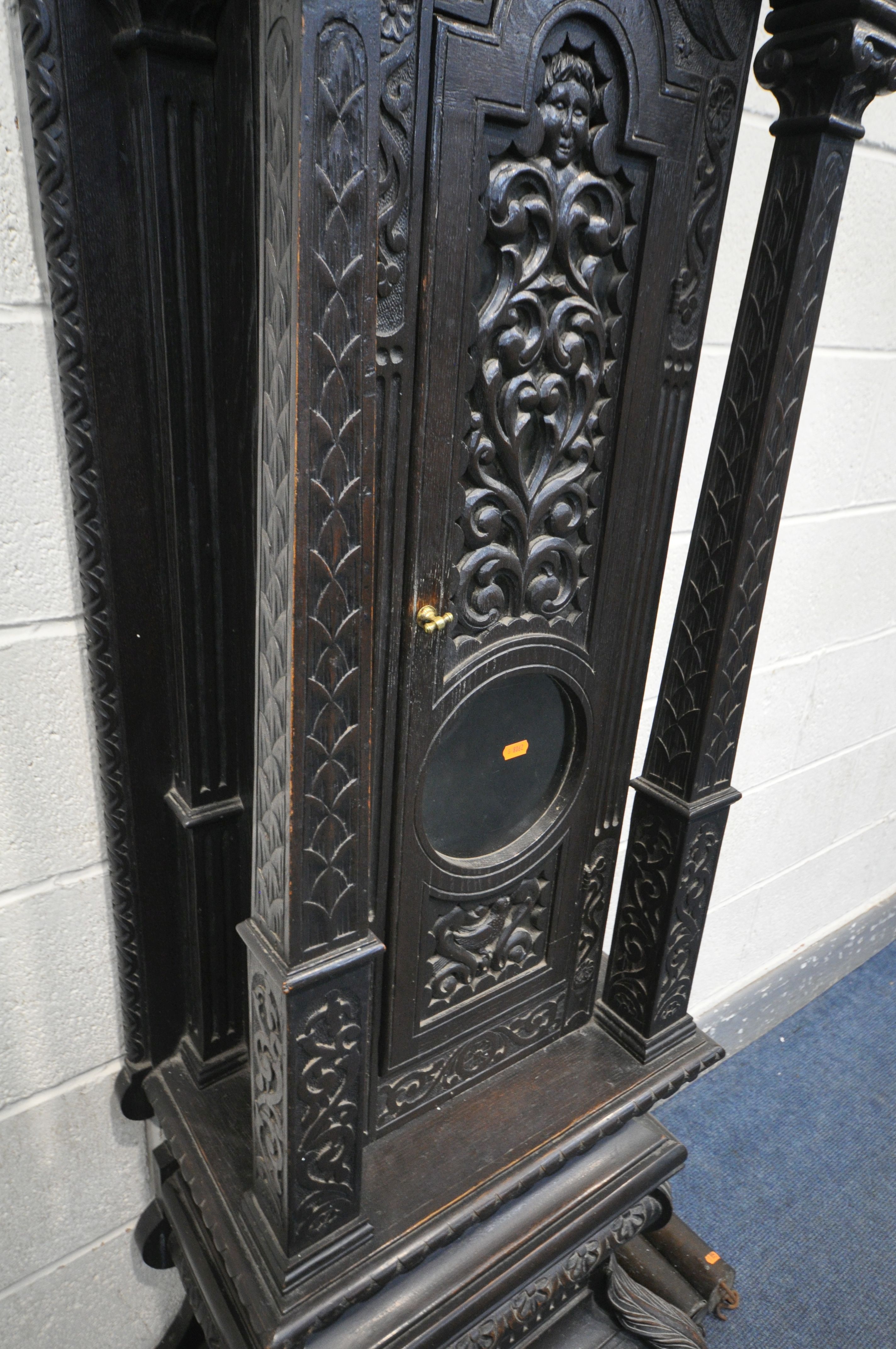 A HEAVILY CARVED EIGHT DAY LONGCASE CLOCK, the 11.5 inch brass and silvered dial singed John - Image 12 of 21