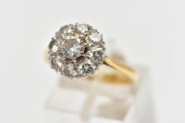 A DIAMOND NINE STONE CLUSTER RING, set with a principal round brilliant cut diamond, surrounded by