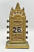 A LATE VICTORIAN BRASS PERPETUAL CALENDAR BY WILLIAM TONKS & SONS, the front plate cast with foliate