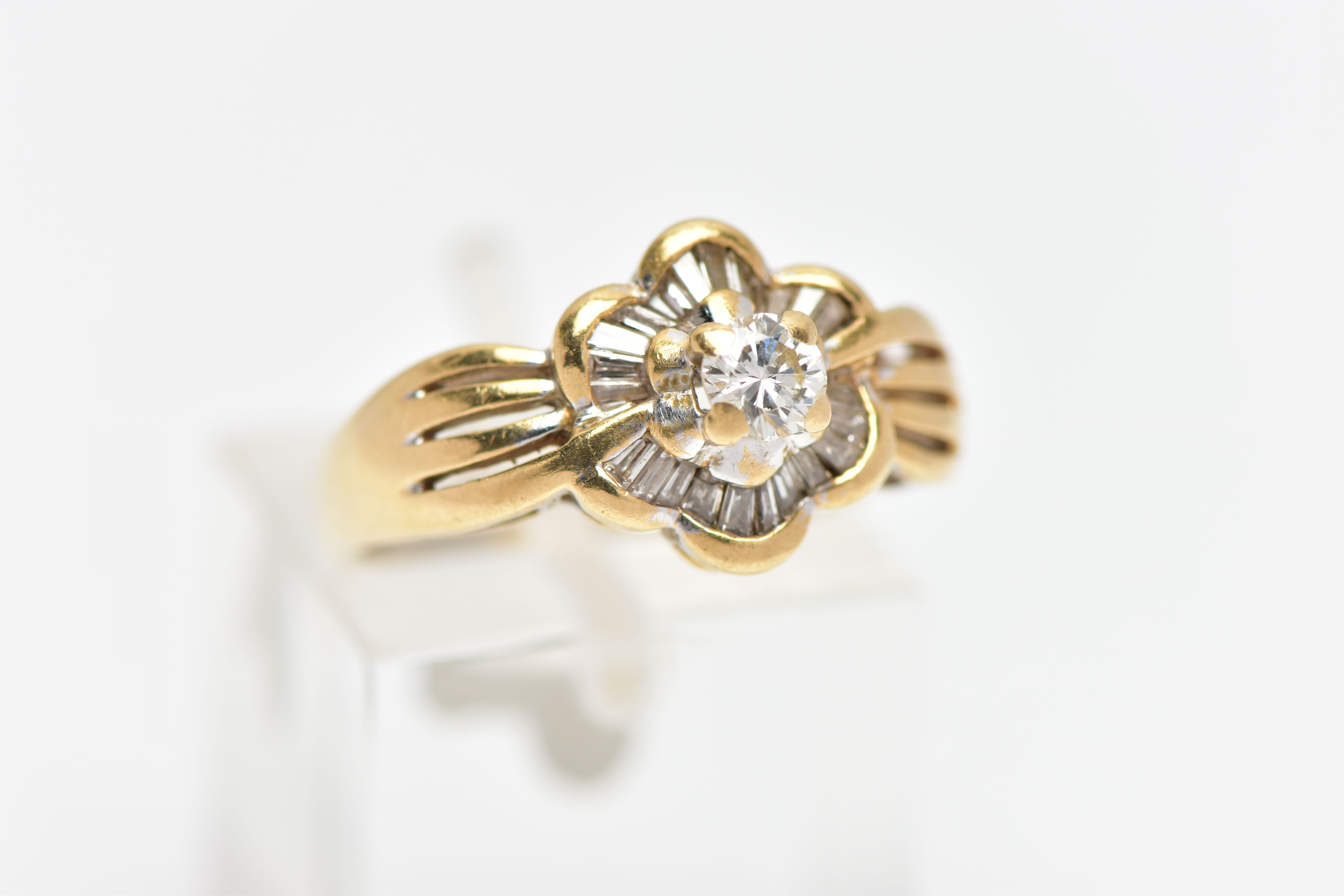 A MODERN YELLOW METAL DIAMOND CLUSTER RING, set with a principal round brilliant cut diamond, within - Image 4 of 8