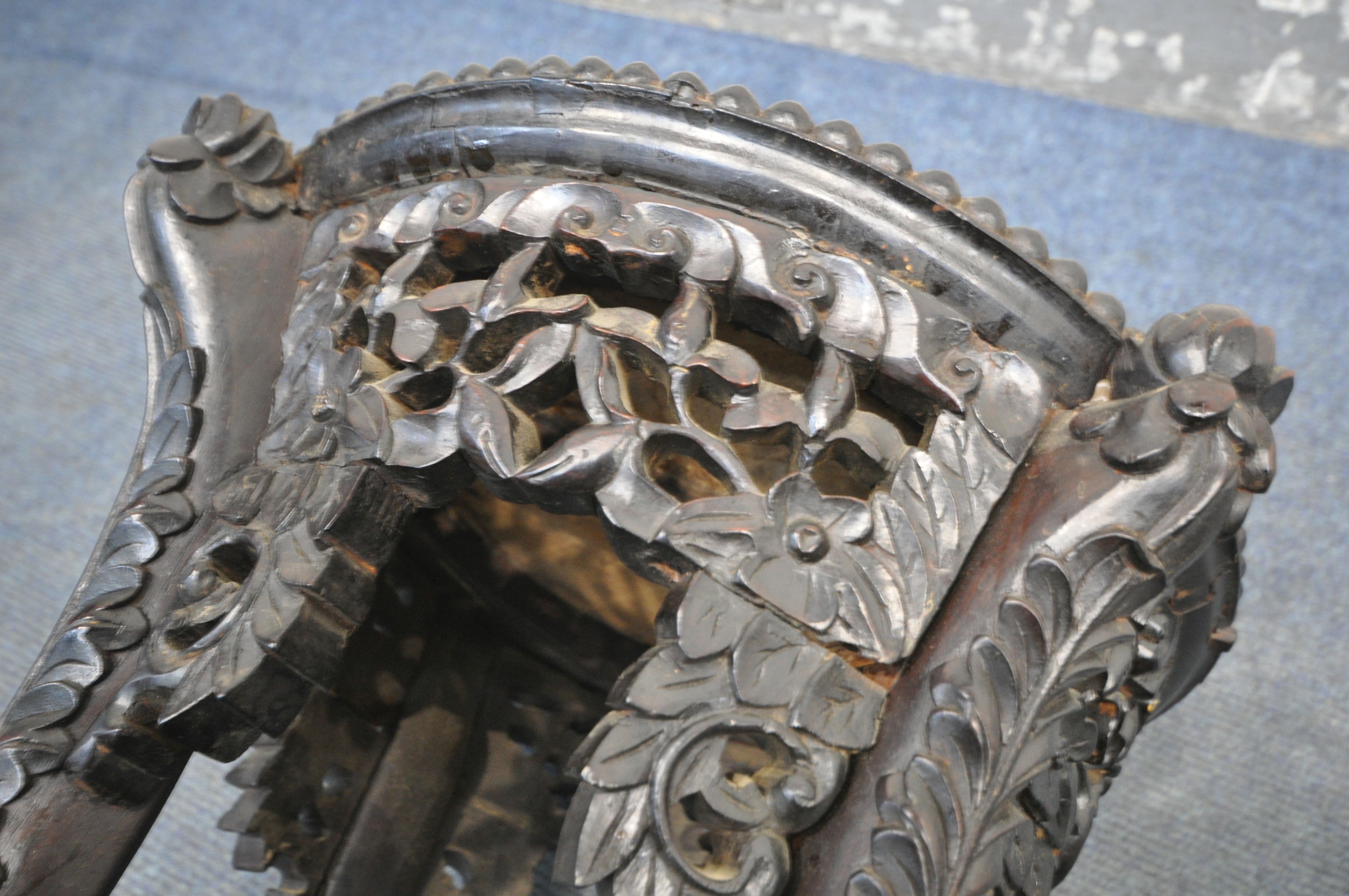 AN INTRICATLY CARVED CIRCULAR CHINESE ROSEWOOD SIDE TABLE, with a veined marble insert, the four - Image 6 of 8