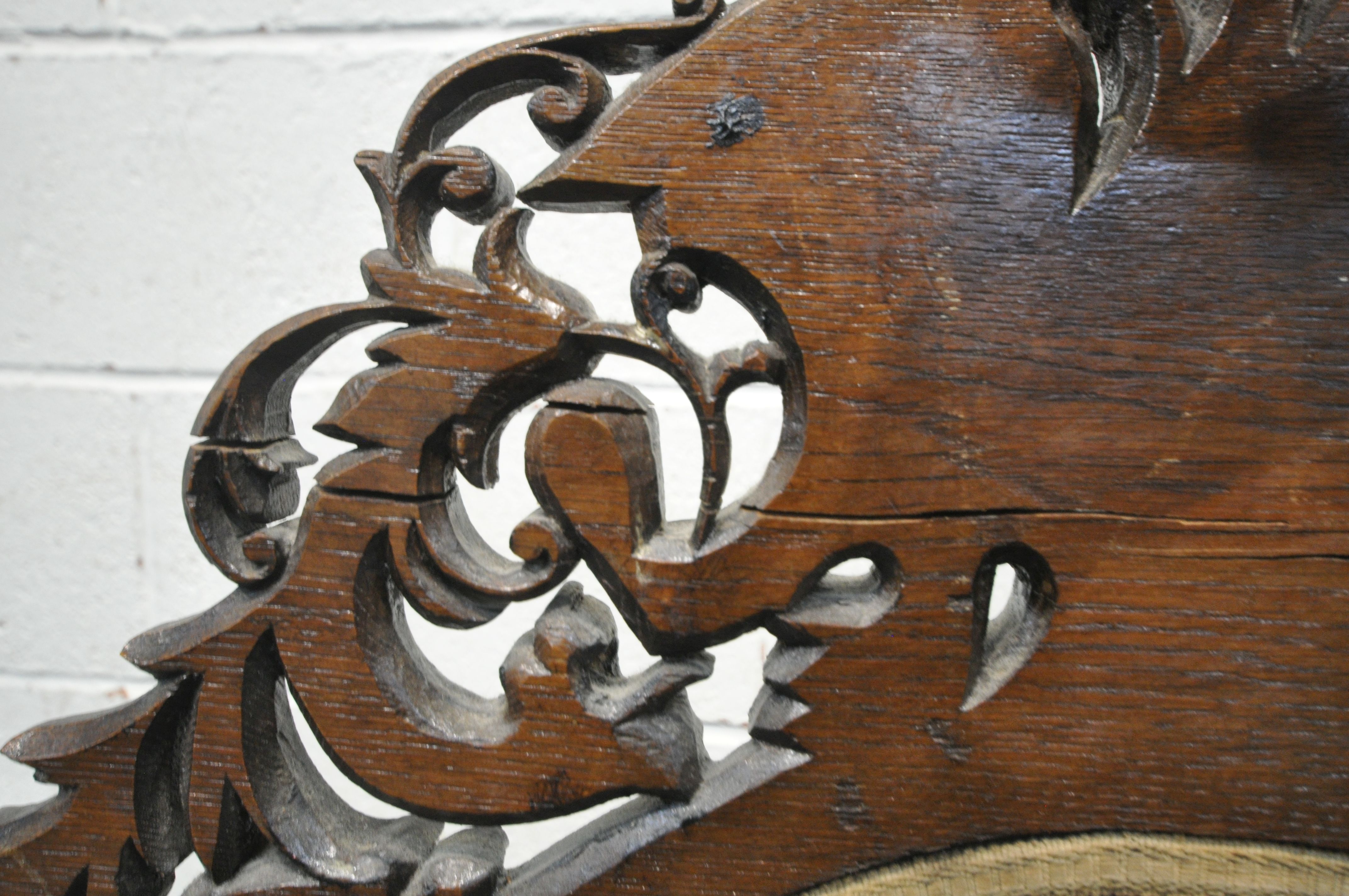 A VICTORIAN CARVED OAK FIRESCREEN, the detailed foliate decorated frame, central lettering reading - Image 6 of 6