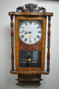 A 19TH CENTURY AMERICAN WALNUT AND INLAID WALL CLOCK, the enamel dial with Roman numerals, with a