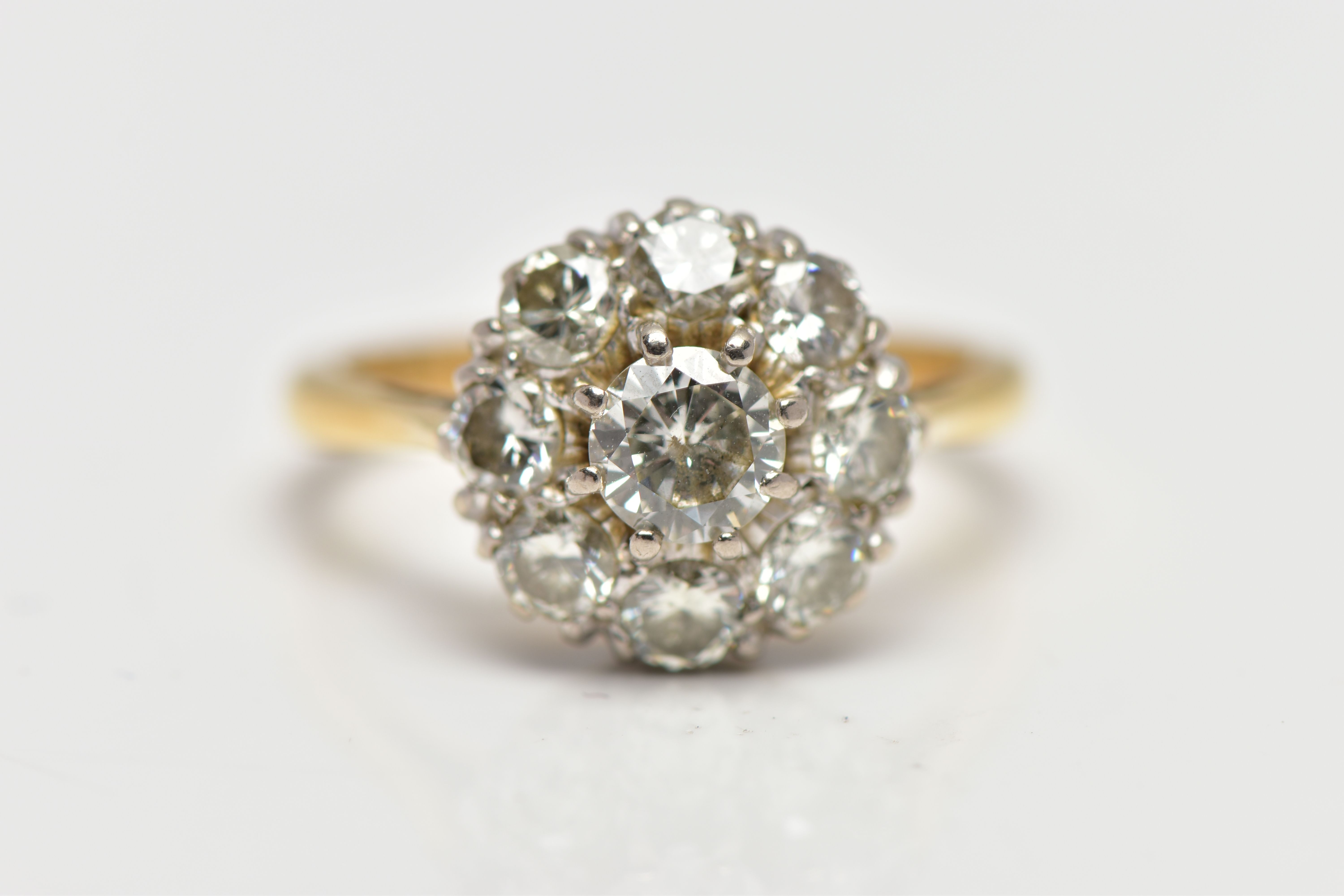 A DIAMOND NINE STONE CLUSTER RING, set with a principal round brilliant cut diamond, surrounded by - Image 6 of 9