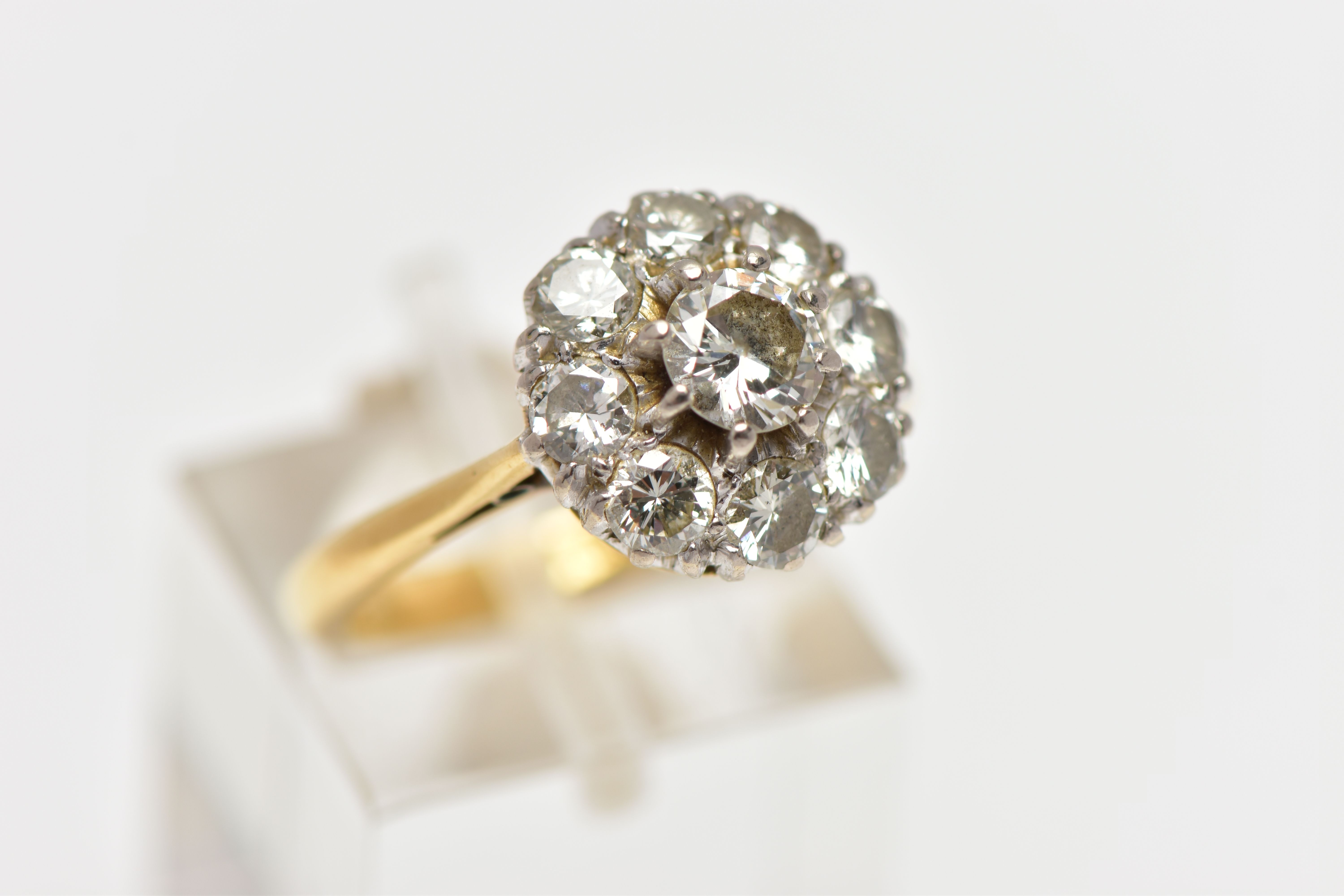 A DIAMOND NINE STONE CLUSTER RING, set with a principal round brilliant cut diamond, surrounded by - Image 4 of 9