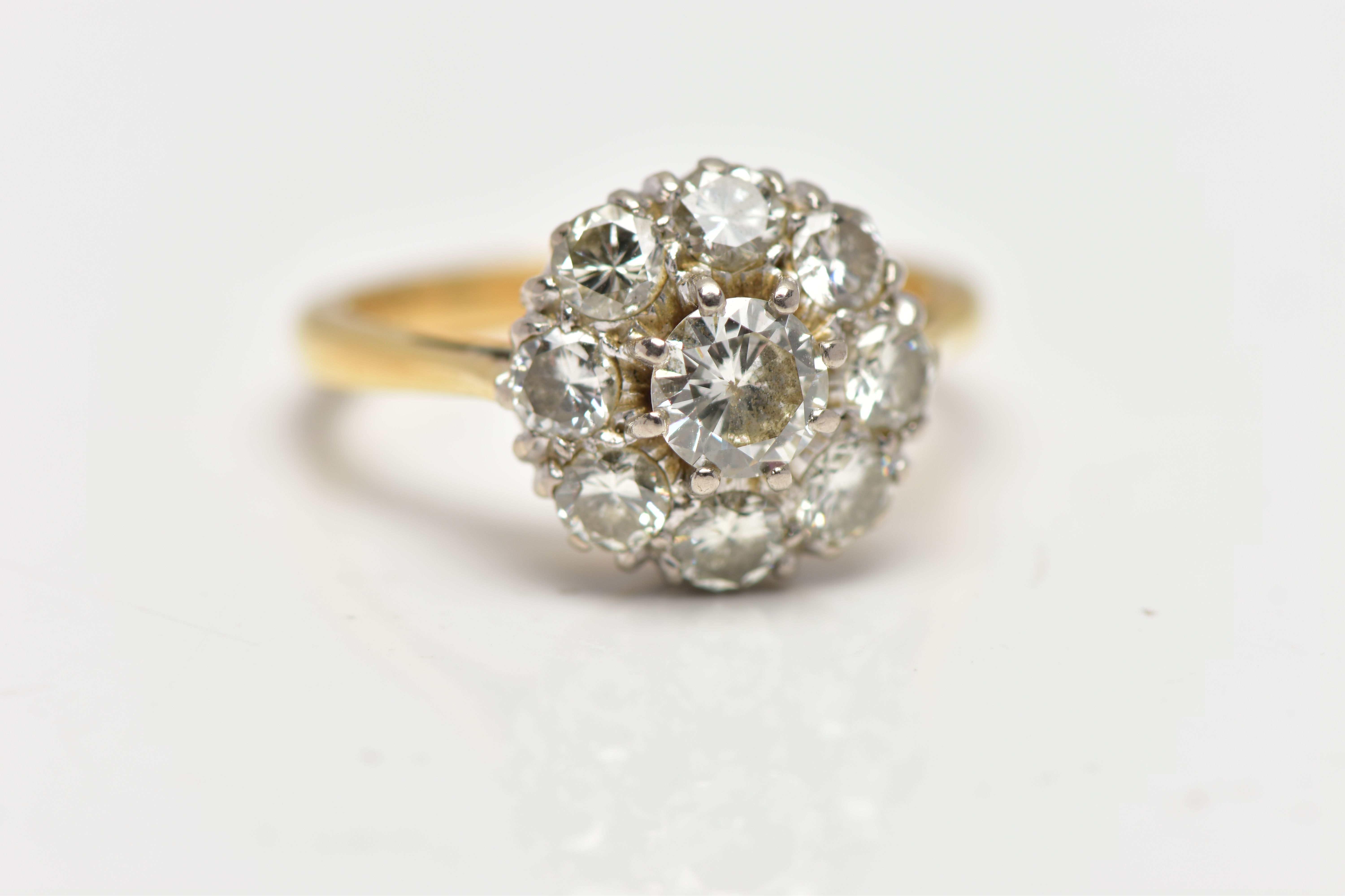 A DIAMOND NINE STONE CLUSTER RING, set with a principal round brilliant cut diamond, surrounded by - Image 5 of 9