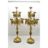 A PAIR OF VICTORIAN ECCLESIASTICAL GOTHIC BRASS TEN LIGHT CANDELABRA IN THE STYLE OF PUGIN, the